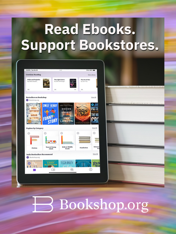 kindle and a stack of books